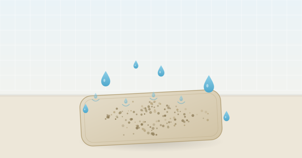 Qu'est-ce que la diatomite . Illustration d'un tapis de bain en pierre de diatomite qui absorbe des gouttes d'eau